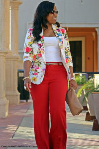 a floral printed blazer with a matching jeans trouser