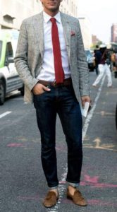 ash blazer with white shirt and long neck tie and dark blue jeans