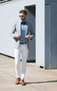 ash blazer with white trouser and sky blue shirt with black bow tie