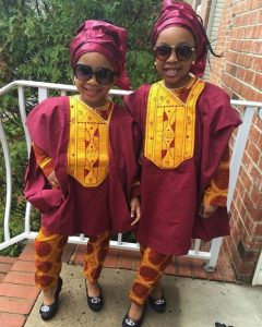 adorable ankara agbada style for kid girls with a matching hair style and sunglasses - stylevitae