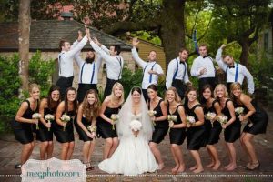 bridal train pose at the front while groomsmen pose at the back - bridalguide