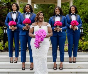 brides train on blue trouser suits with bow tie while bride pose with her wedding dress and flower - buzzfeed