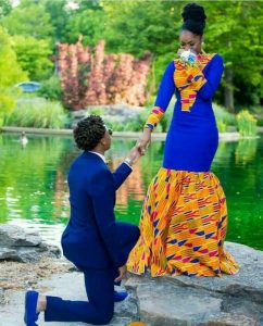 engagement with the groom on navy blue while the lady rocks a similar blue gown with kente fabric design - etsy