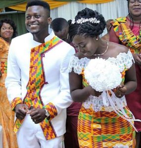 enticing plain suit with stylish touch of kente for the groom - the lady in full kente outfit with lace design - momoafrica