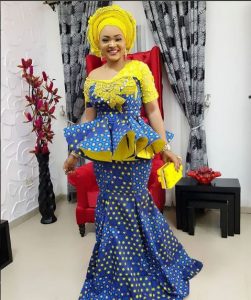 mercy aigbe gorgeous ankara skirt and peplum blouse outfit with a yellow purse - nairaland