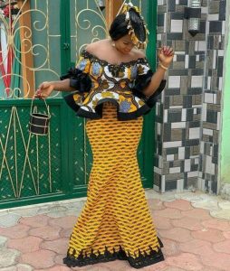 ankara lace off shoulder peplum blouse with long mermaid skirt, hip flay skirt style, with fascinator hair piece