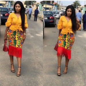 classy ankara pencil skirt with fringes, rocked with cute blouse, for curvy young ladies