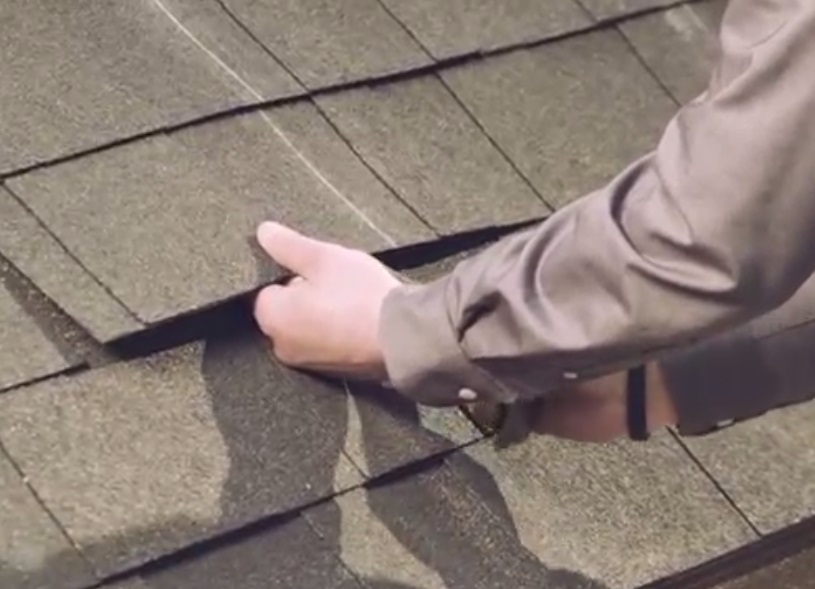 Using a flat bar to check for nails that will obstruct the flashings